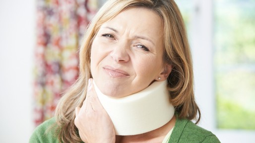 Woman Reading Letter After Receiving Neck Injury