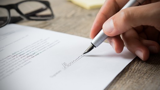 Man signing contract