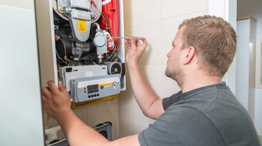 Technician repairing Gas Furnace