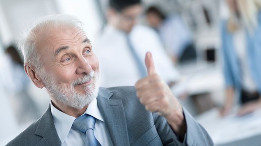 Senior Business Man showing thumbs up