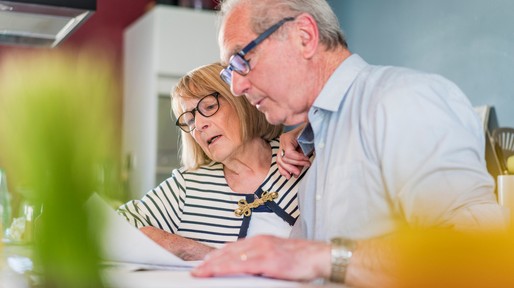 Senior couple calculating home finance