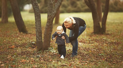 Yong mother with her lovely son in garden
