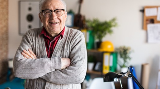 Smiling active senior with arms crossed
